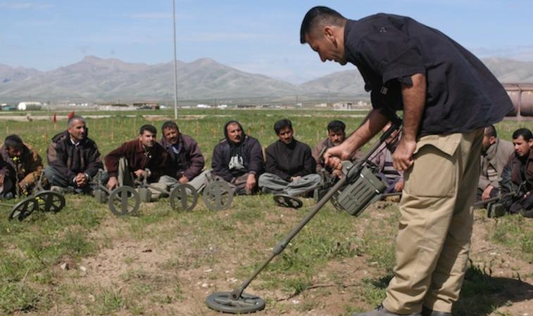 Deminers in northern Iraq are training in the use of a metal detector (c) Brian Liu, ToolboxDC, 2004